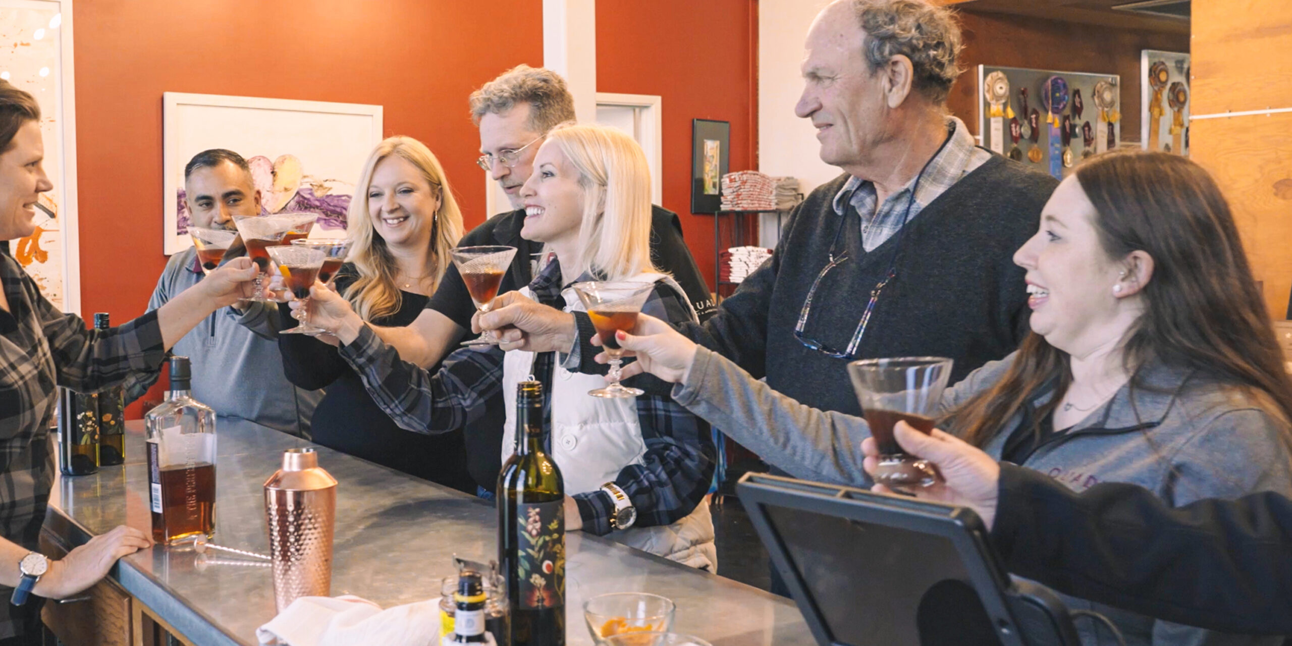 Picture of wine tasters cheering in Quady's tasting room