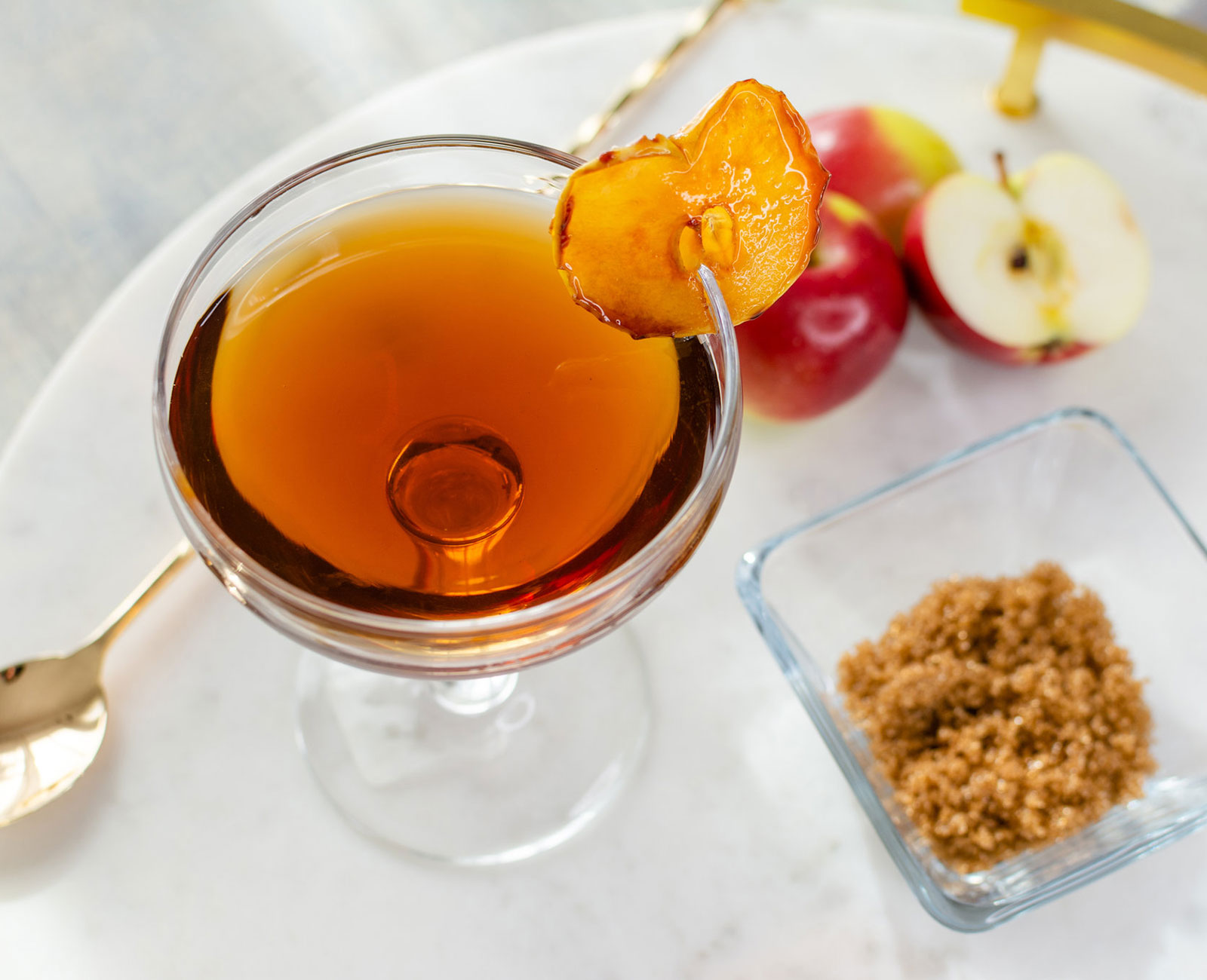 Apple Cider Manhattan with apples and brown sugar